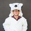 white polar bear Griz Coat against gray wall