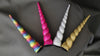 The four horn colors available for the Unicorn Coat