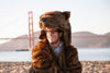 Faux fur brown bear jacket by Griz Coat at the beach