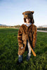 Faux fur brown griz coat in the grass