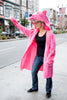 Griz Coat's Pink Agenda Bear Coat hailing a cab